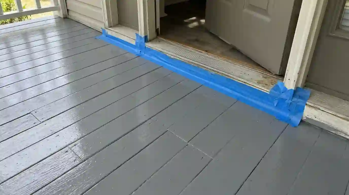 Freshly painted gray tongue-and-groove porch floor