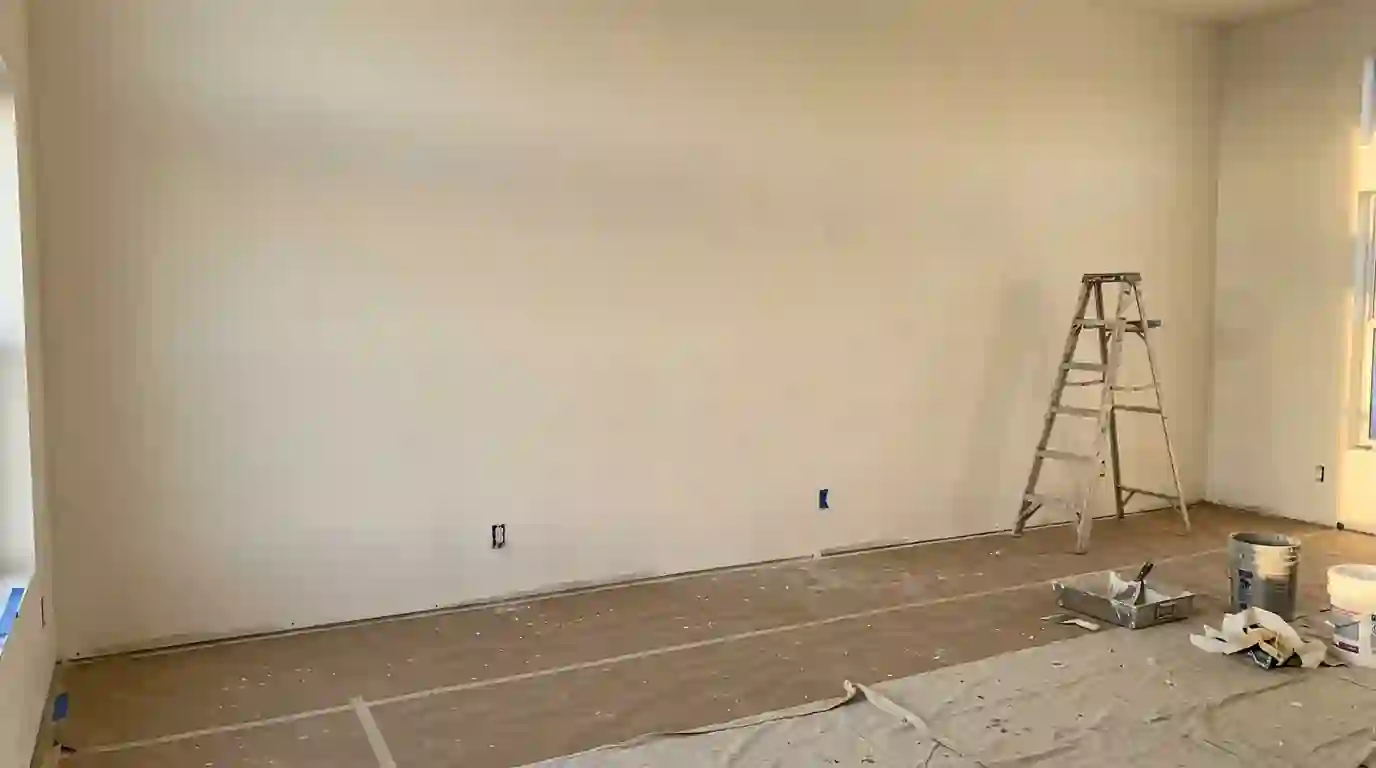 Great room wall primed smooth after a full skim coat